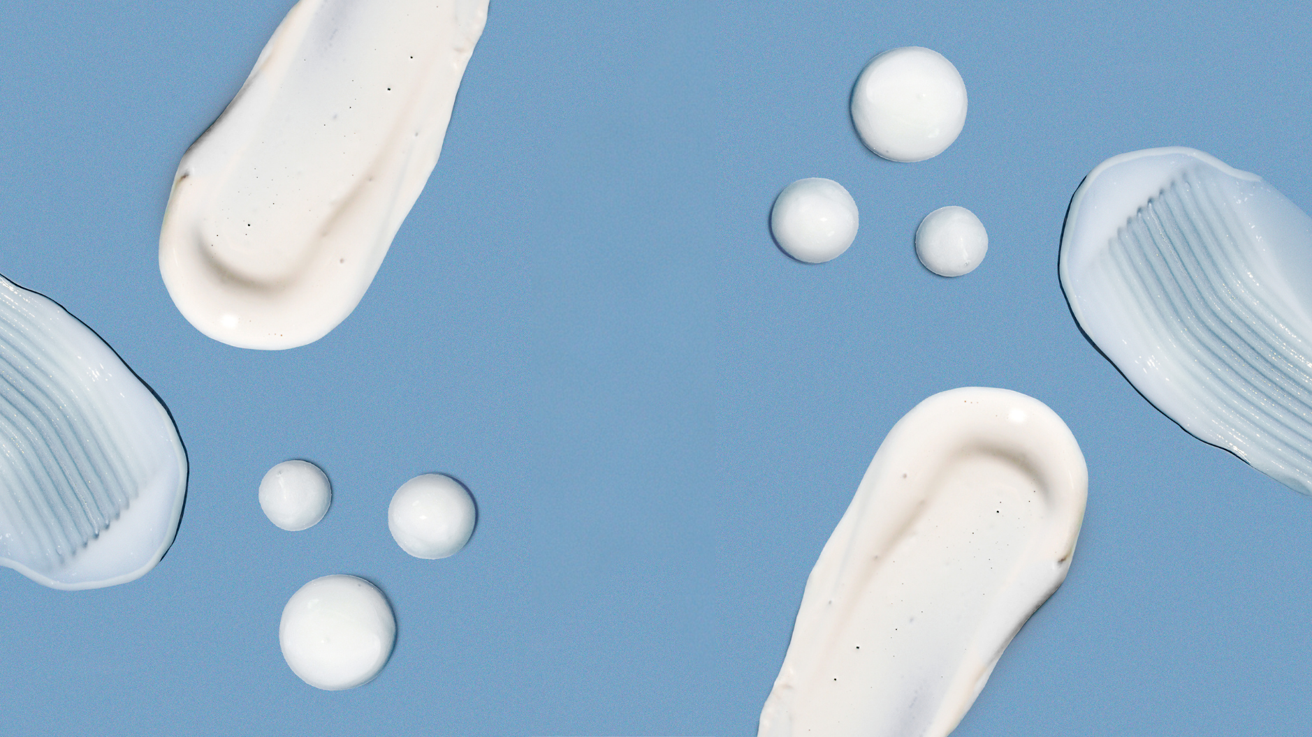 Flat lay of Girlyish Skincare product textures in cream and gel swatches and droplets arranged on a blue background