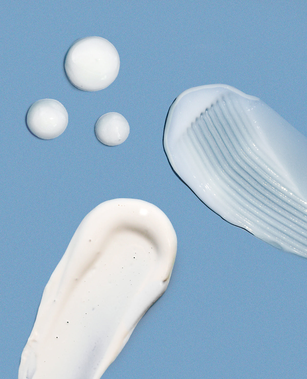 A photo of the textures of Girlyish cleanser, moisturizer, and sunscreen
